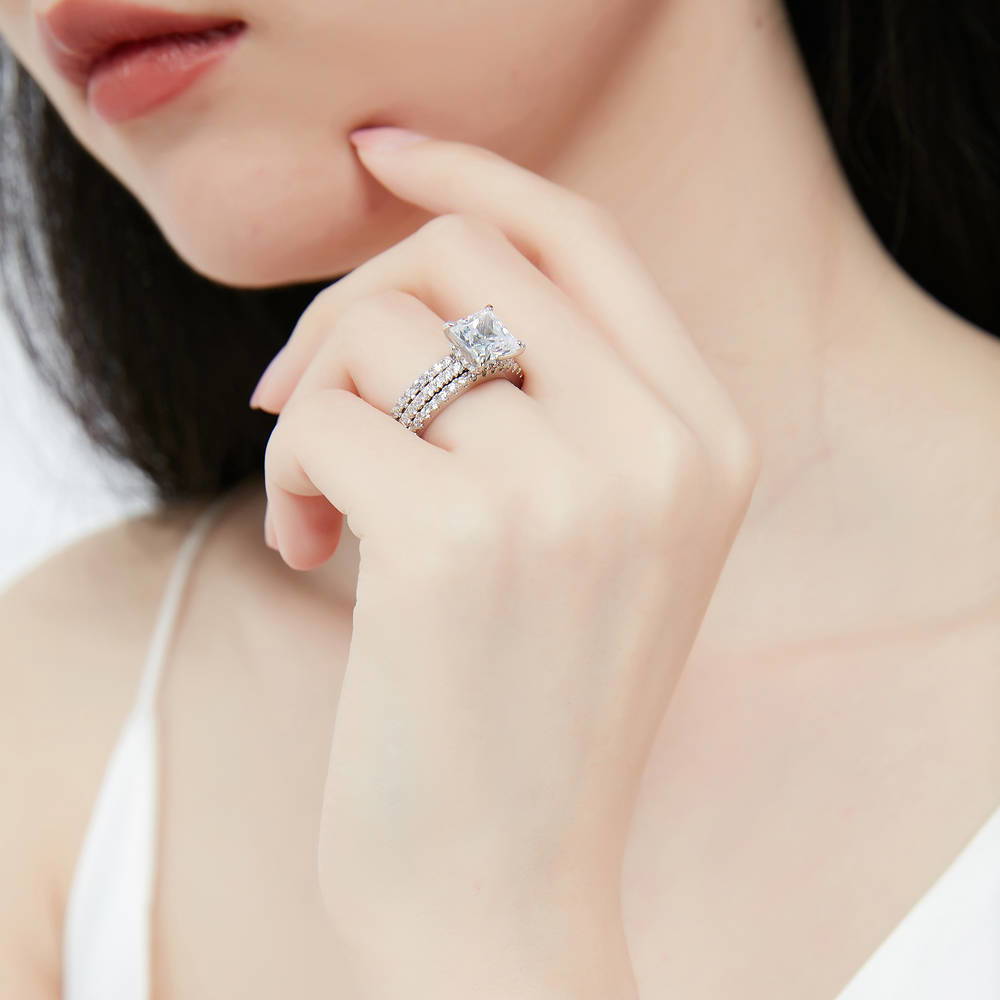 Model wearing Hidden Halo Solitaire CZ Ring Set in Sterling Silver