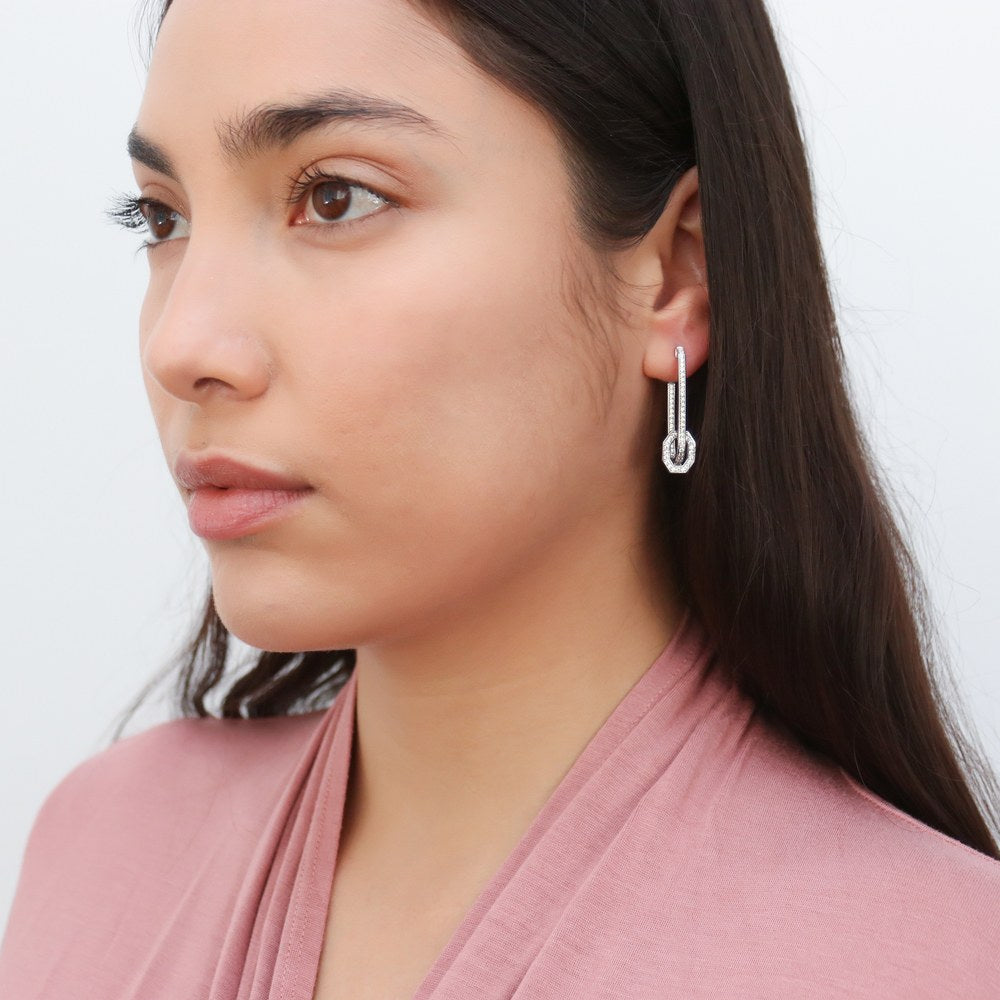 Model wearing Rectangle CZ Medium Inside-Out Hoop Earrings in Sterling Silver 1.3 inch, 3 of 5