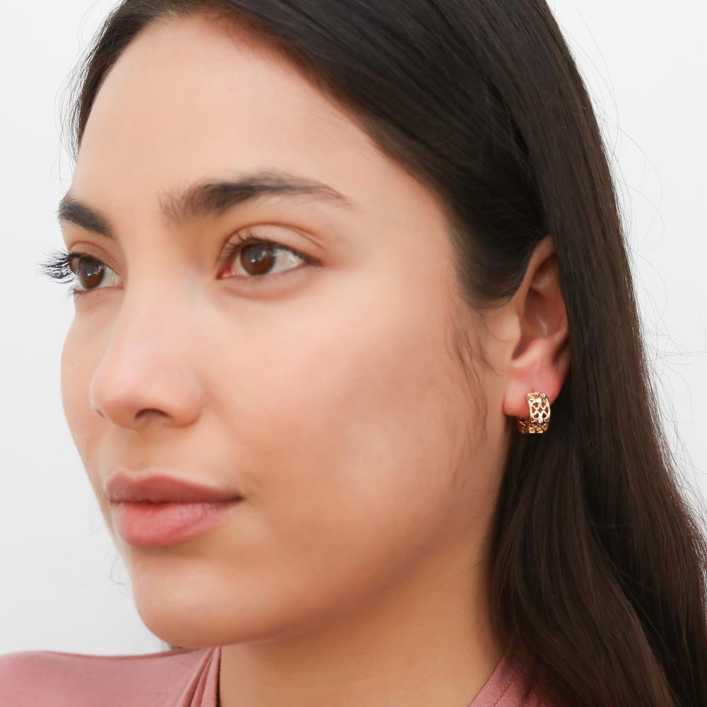 Model wearing Clover CZ Small Huggie Earrings in Sterling Silver 0.55 inch