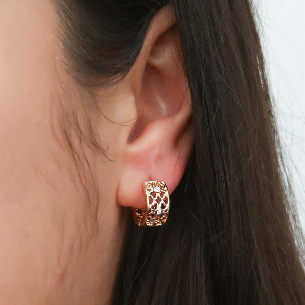 Model wearing Clover CZ Small Huggie Earrings in Sterling Silver 0.55 inch