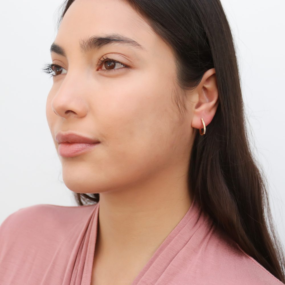 Model wearing Oval Bar CZ Medium Hoop Earrings in Sterling Silver 0.6 inch