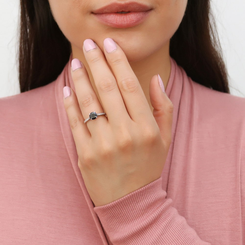 Model wearing Solitaire Black and White Round CZ Ring in Sterling Silver 1ct