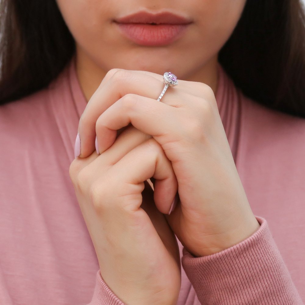 Model wearing Halo Purple Round CZ Ring in Sterling Silver