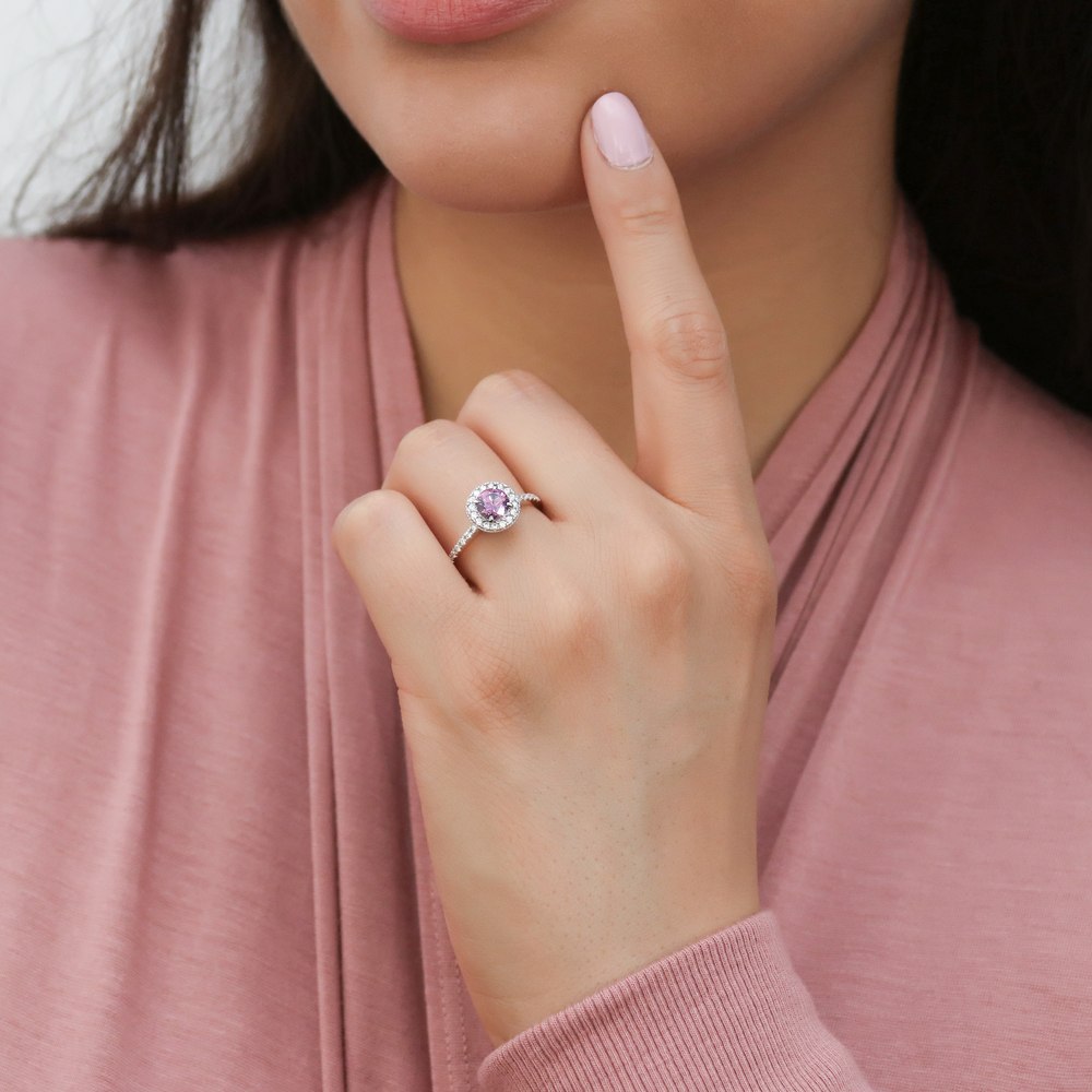 Model wearing Halo Purple Round CZ Ring in Sterling Silver