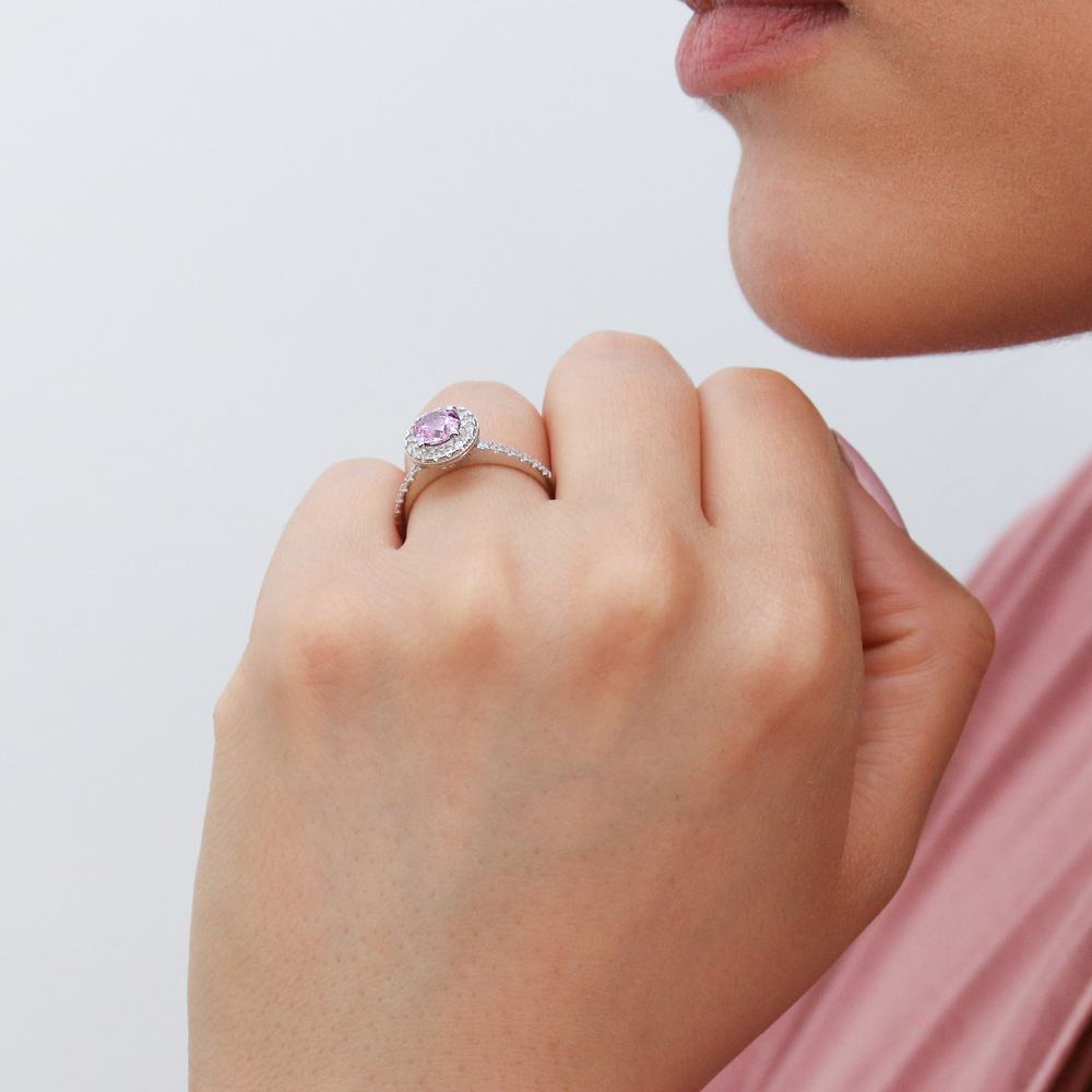Model wearing Halo Purple Round CZ Ring in Sterling Silver