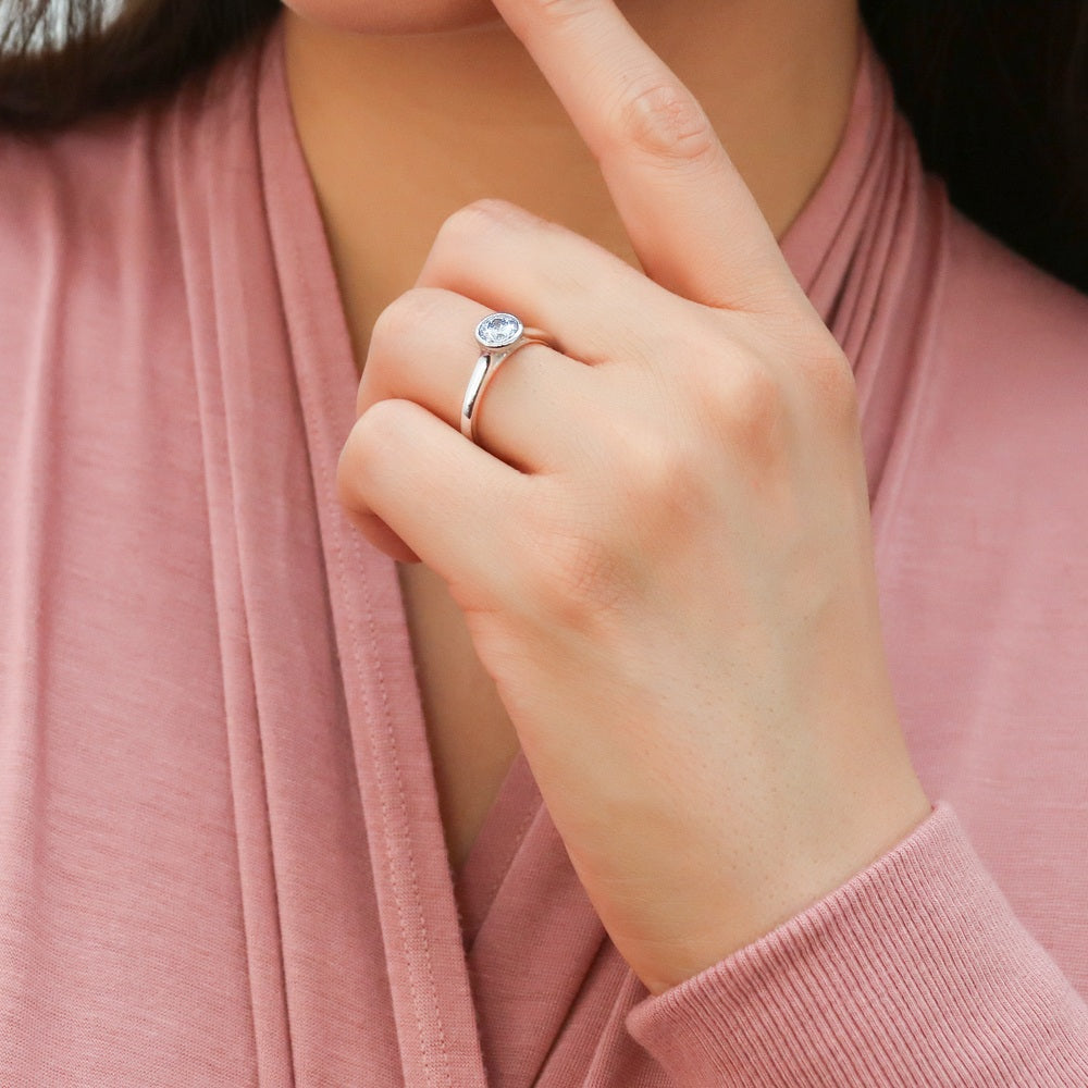 Model wearing Solitaire Greyish Blue Bezel Set Round CZ Ring in Sterling Silver 0.8ct, 3 of 9