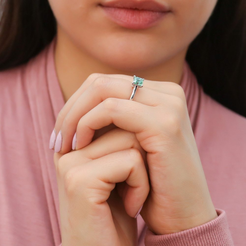 Model wearing Solitaire Green Princess CZ Ring in Sterling Silver 1.2ct