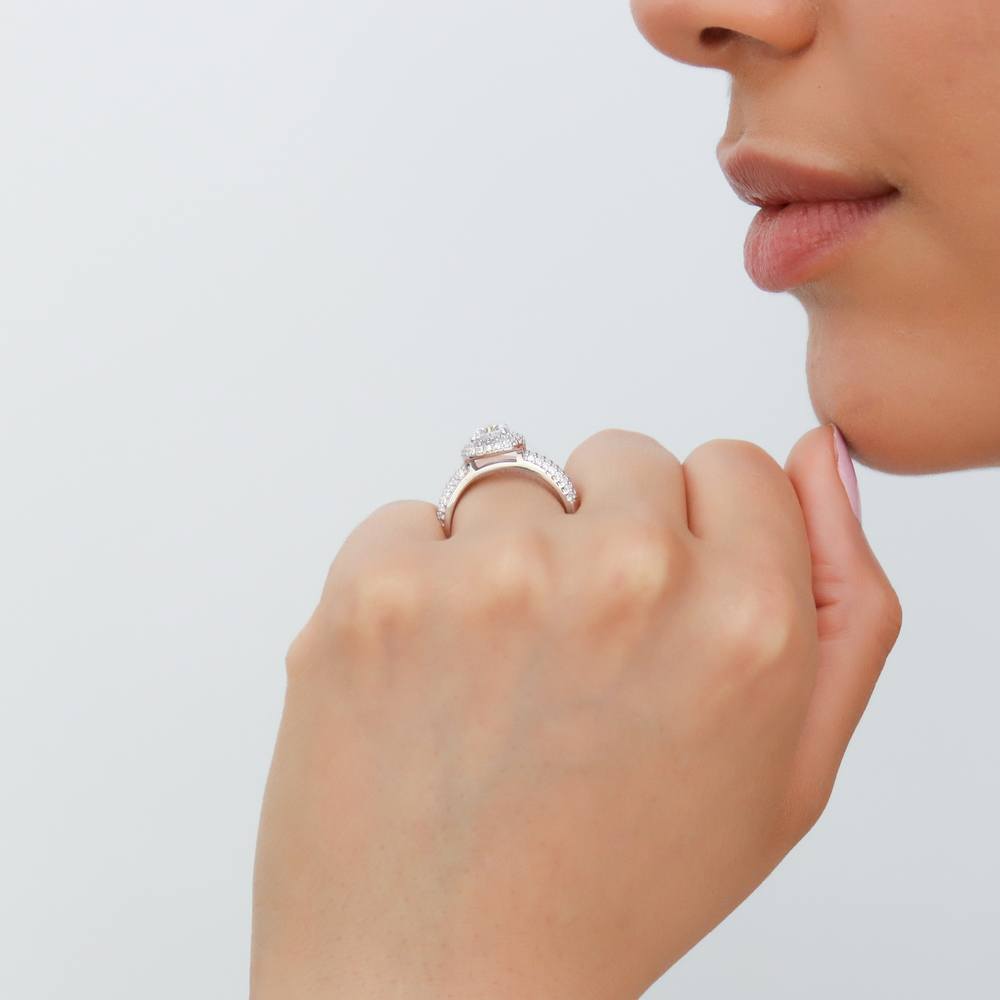 Model wearing Halo Round CZ Ring in Sterling Silver