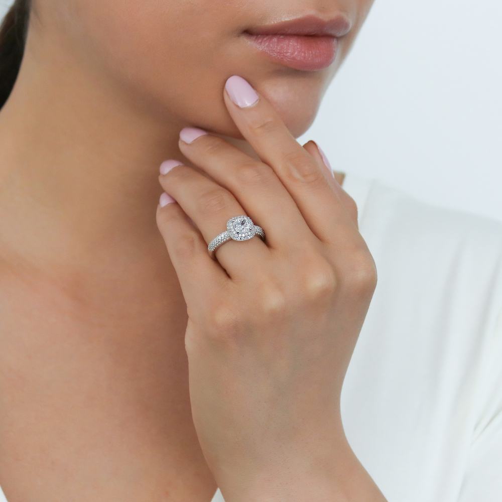 Model wearing Halo Cushion CZ Ring in Sterling Silver