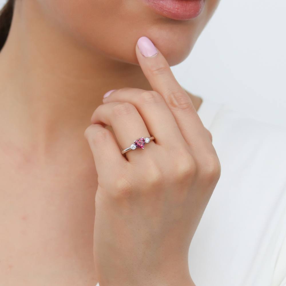 Model wearing 3-Stone Heart Red CZ Ring Set in Sterling Silver