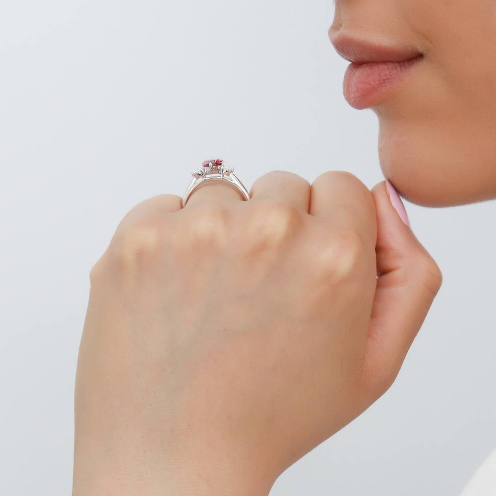 Model wearing 3-Stone Heart Red CZ Ring in Sterling Silver