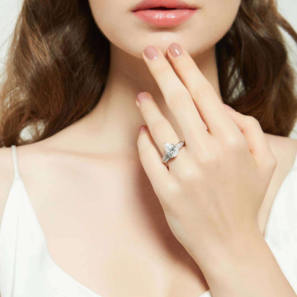 Model wearing Solitaire 3ct Pear CZ Ring in Sterling Silver