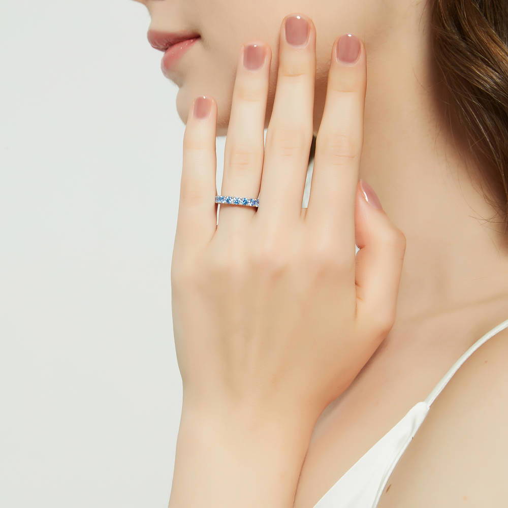 Model wearing Blue CZ Eternity Ring in Sterling Silver, 2 of 8