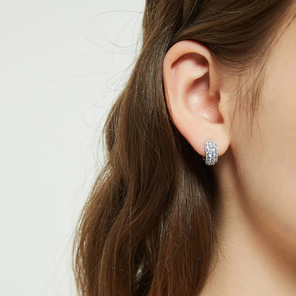 Model wearing CZ Small Huggie Earrings in Sterling Silver 0.5 inch