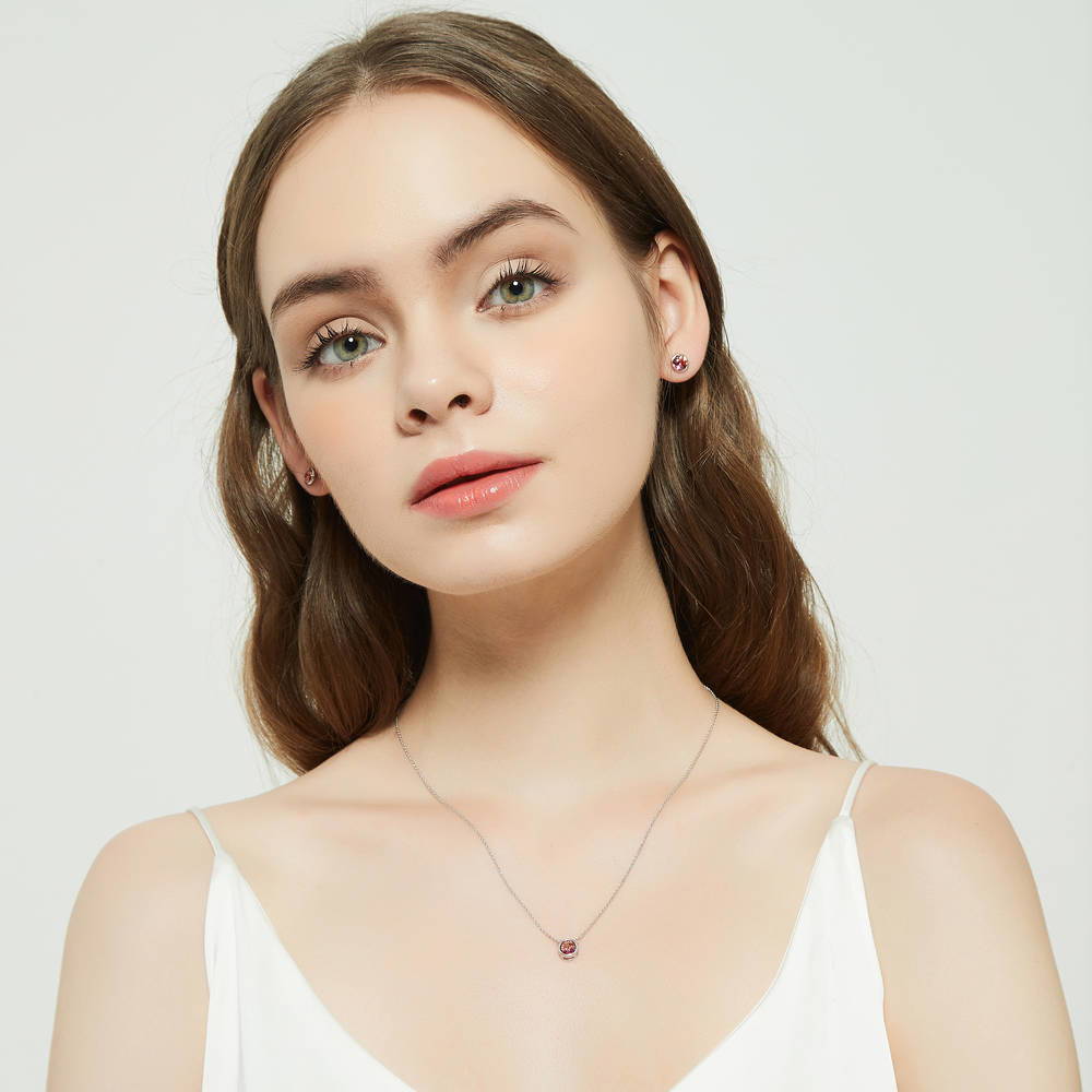 Model wearing Solitaire Bezel Set Round CZ Pendant Necklace in Sterling Silver 0.8ct