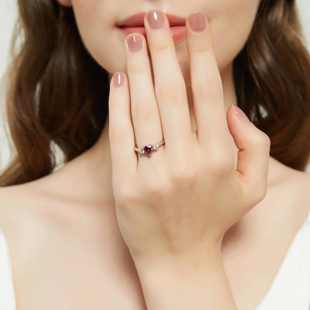 Model wearing 3-Stone Heart Red CZ Ring Set in Sterling Silver