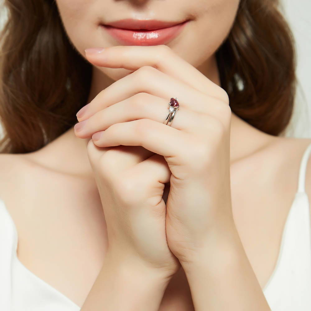 Model wearing 3-Stone Heart Red CZ Ring Set in Sterling Silver