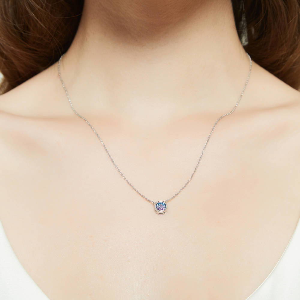 Model wearing Solitaire Bezel Set Round CZ Pendant Necklace in Sterling Silver 0.8ct, 9 of 16