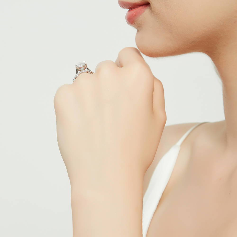 Model wearing Solitaire 5.5ct Oval CZ Ring Set in Sterling Silver