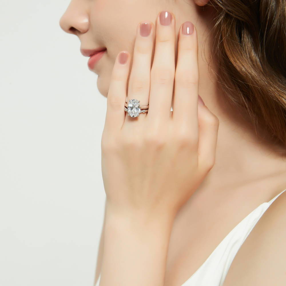 Model wearing Solitaire 5.5ct Oval CZ Ring Set in Sterling Silver