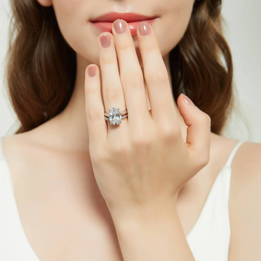Model wearing Solitaire 5.5ct Oval CZ Ring Set in Sterling Silver