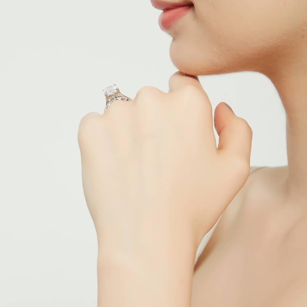 Model wearing Solitaire 5.5ct Oval CZ Ring Set in Sterling Silver