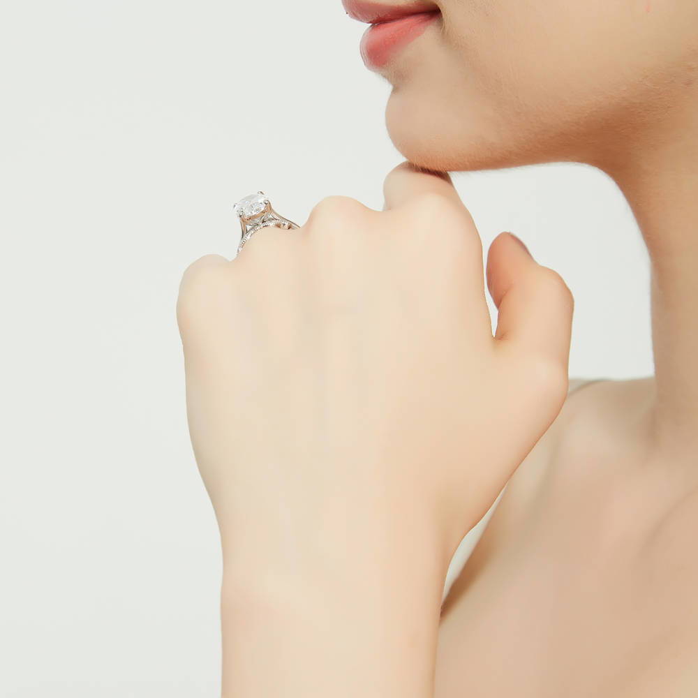 Model wearing Solitaire 5.5ct Oval CZ Ring Set in Sterling Silver, 8 of 18