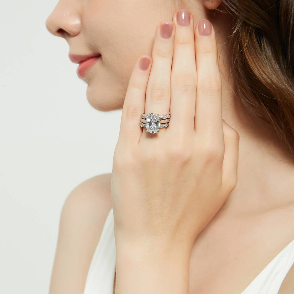 Model wearing Solitaire 5.5ct Oval CZ Ring Set in Sterling Silver