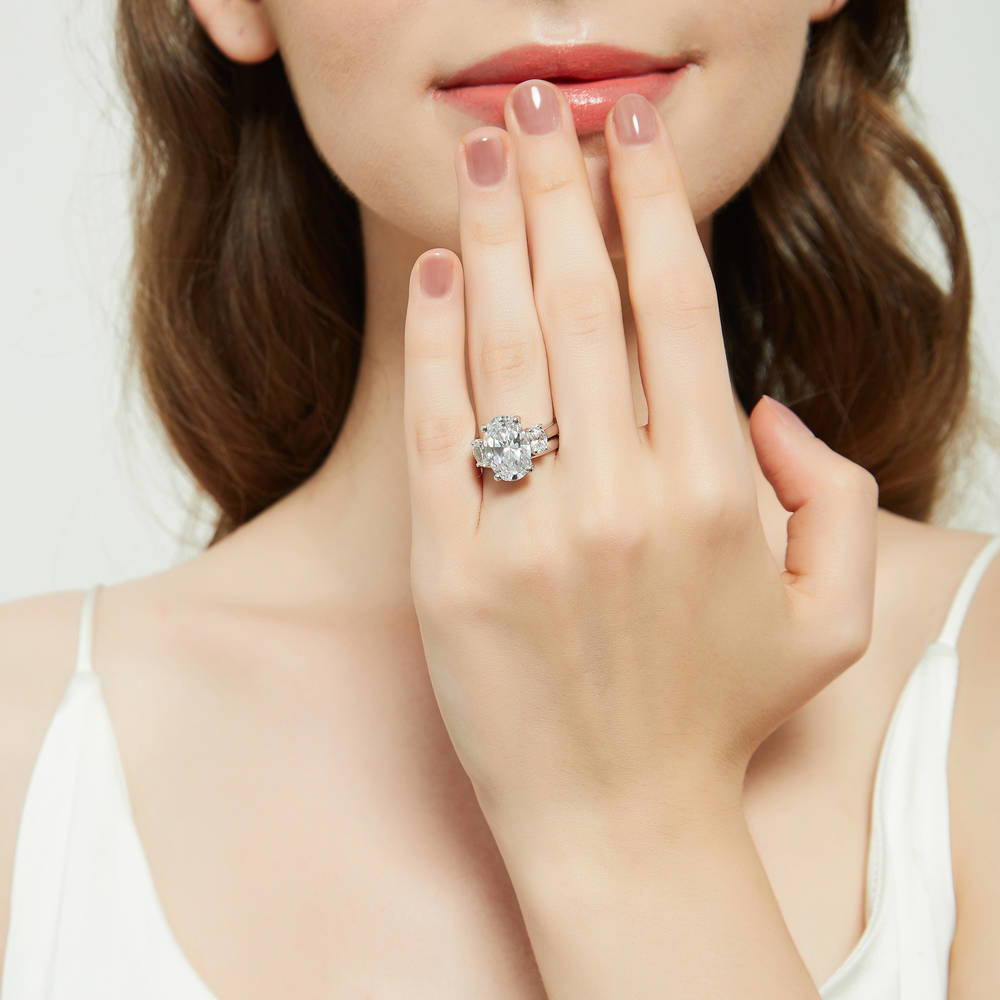 Model wearing 3-Stone Oval CZ Ring Set in Sterling Silver