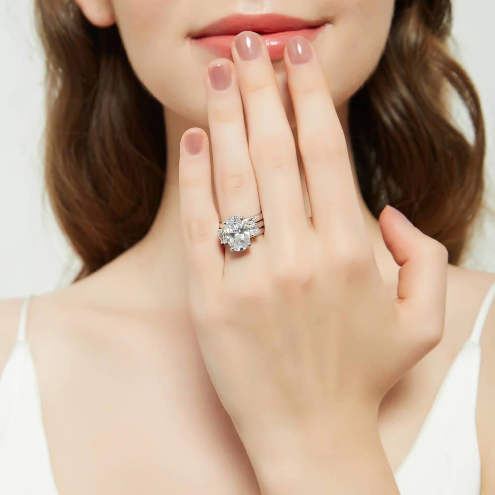 Model wearing 3-Stone Oval CZ Ring Set in Sterling Silver