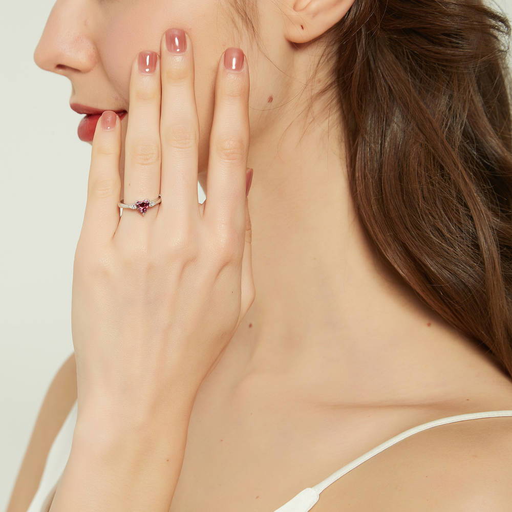 Model wearing 3-Stone Heart Red CZ Ring in Sterling Silver