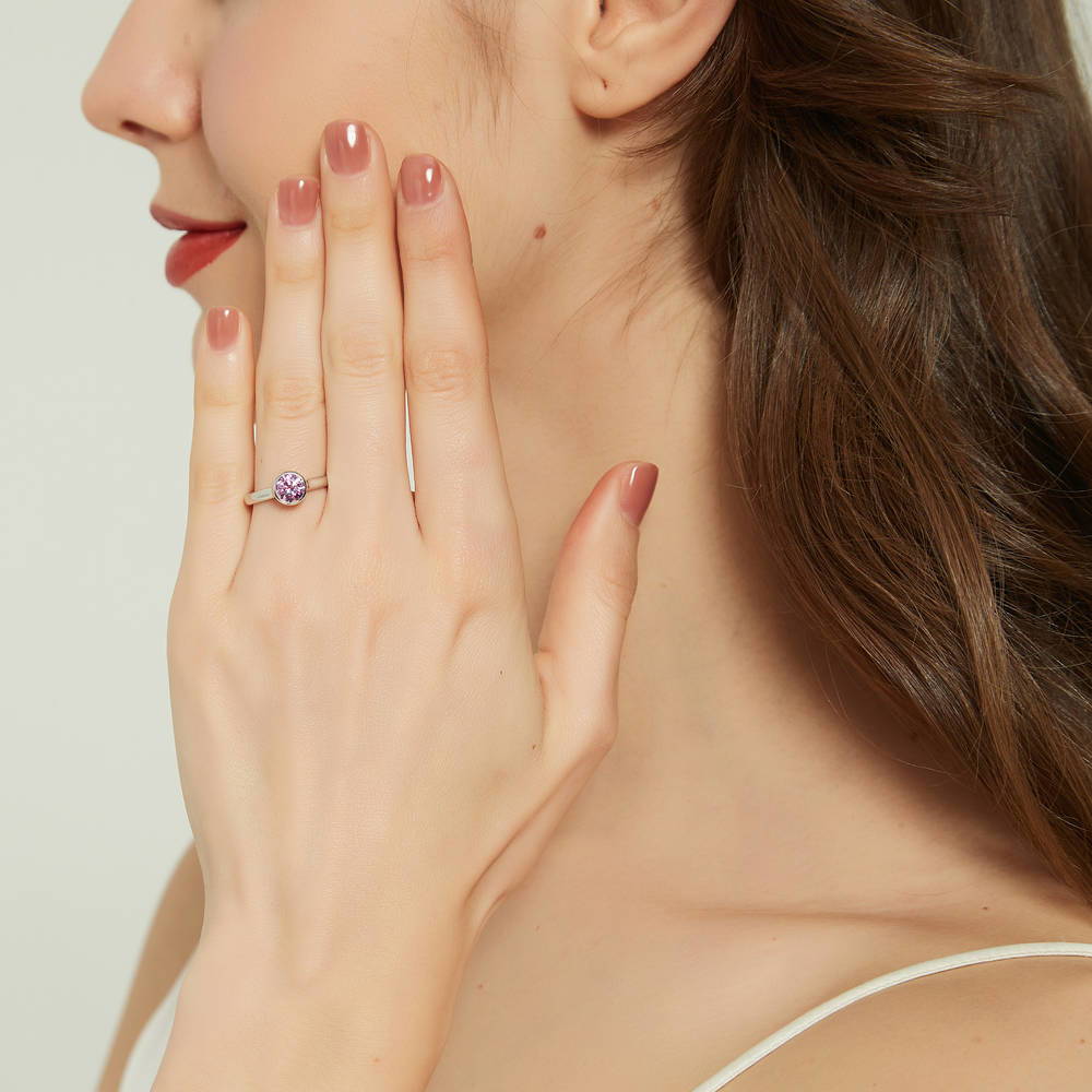 Model wearing Solitaire Purple Bezel Set Round CZ Ring in Sterling Silver 0.8ct