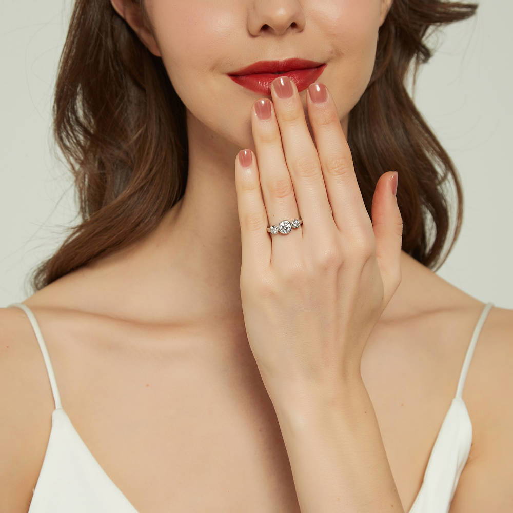 Model wearing 3-Stone Round CZ Ring in Sterling Silver