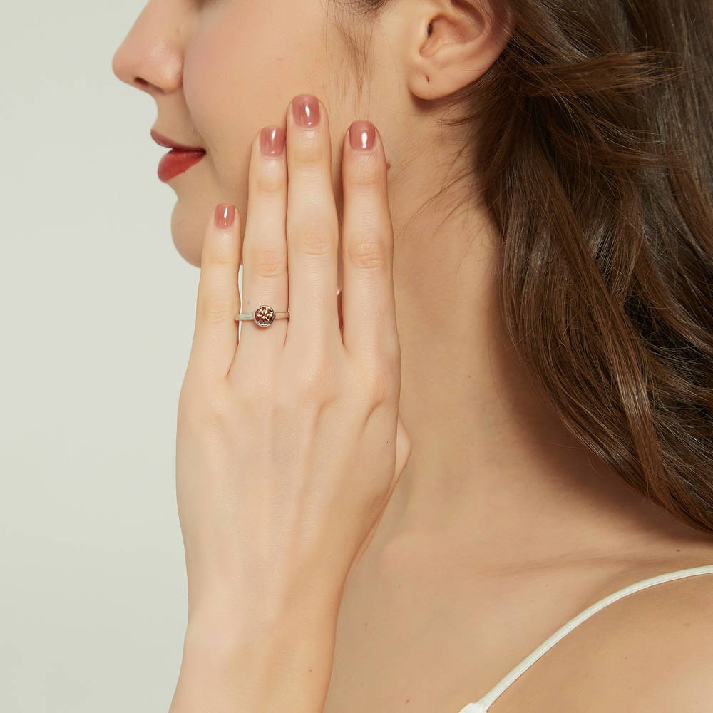 Model wearing Solitaire Caramel Bezel Set Round CZ Ring in Sterling Silver 0.8ct
