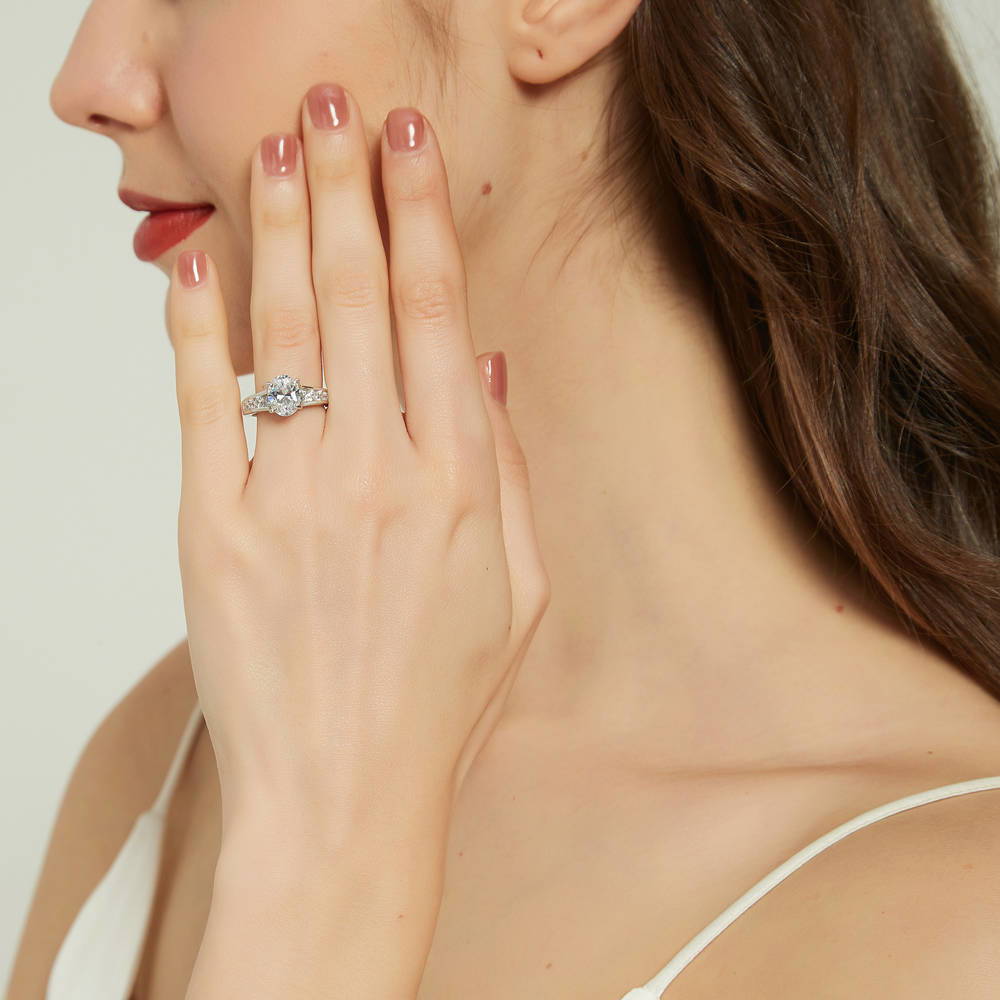 Model wearing Solitaire 2.5ct Oval CZ Ring Set in Sterling Silver