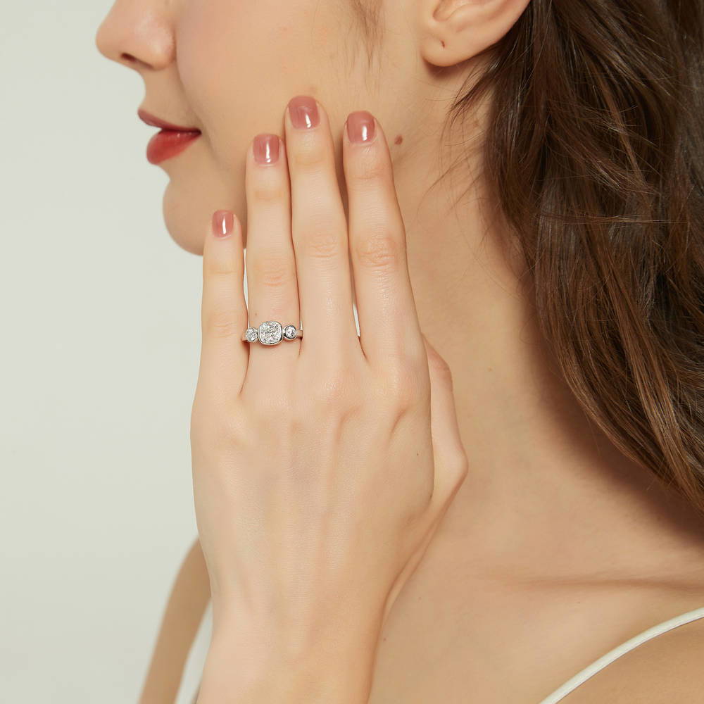 Model wearing 3-Stone Cushion CZ Ring in Sterling Silver