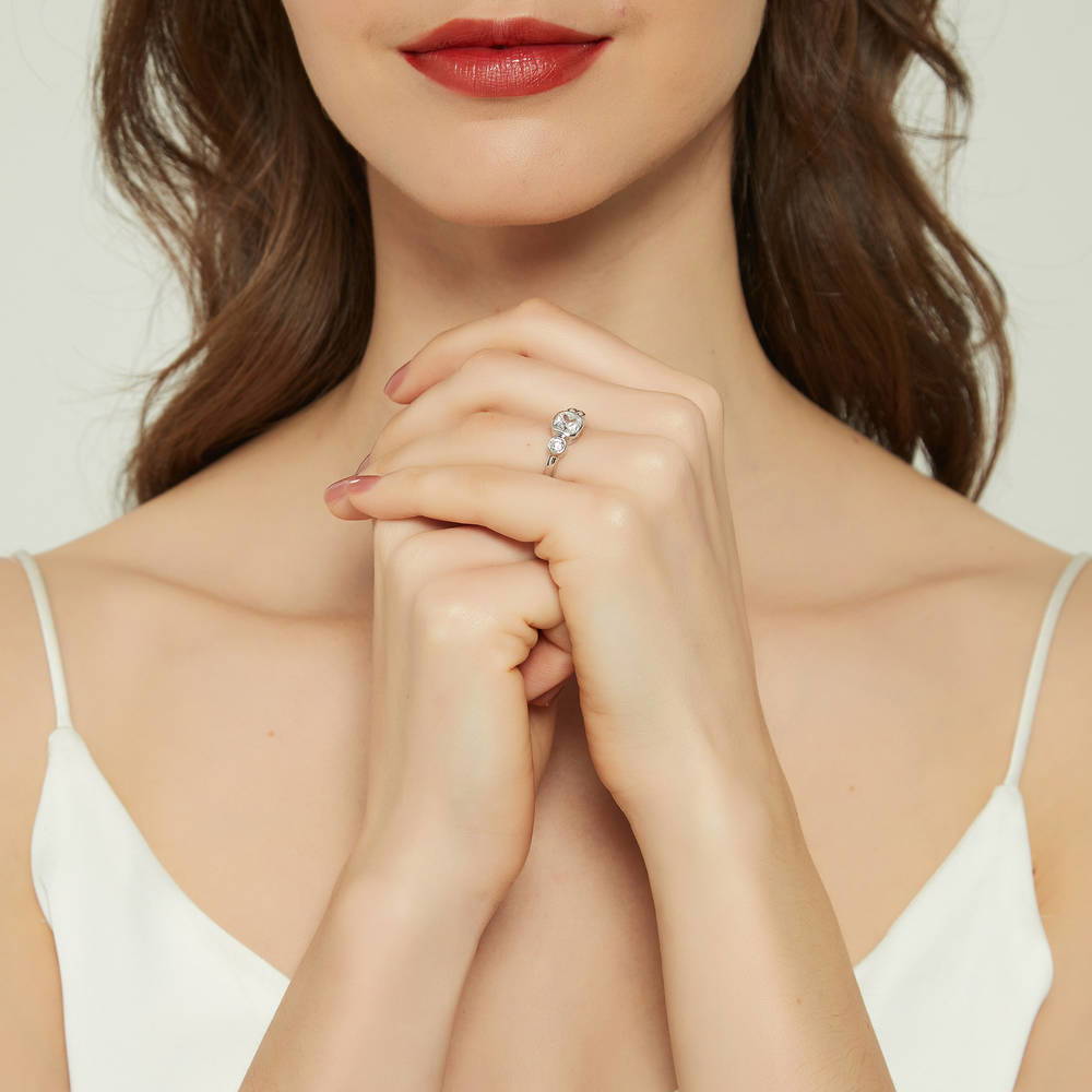 Model wearing 3-Stone Cushion CZ Ring in Sterling Silver