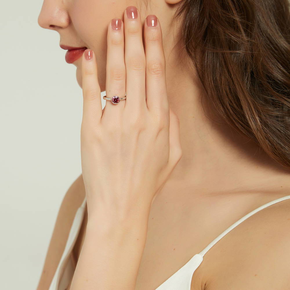 Model wearing Solitaire Red Bezel Set Round CZ Ring in Sterling Silver 0.8ct