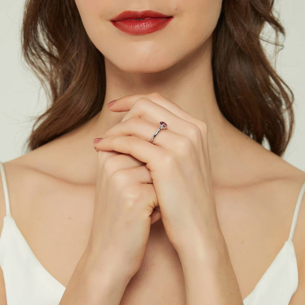 Model wearing Solitaire Red Bezel Set Round CZ Ring in Sterling Silver 0.8ct
