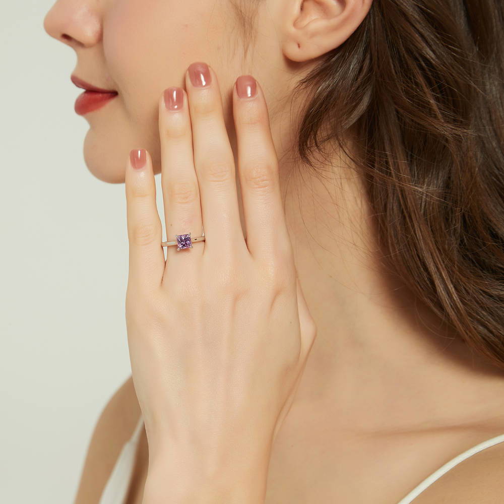 Model wearing Solitaire 1.2ct Purple Princess CZ Ring Set in Sterling Silver
