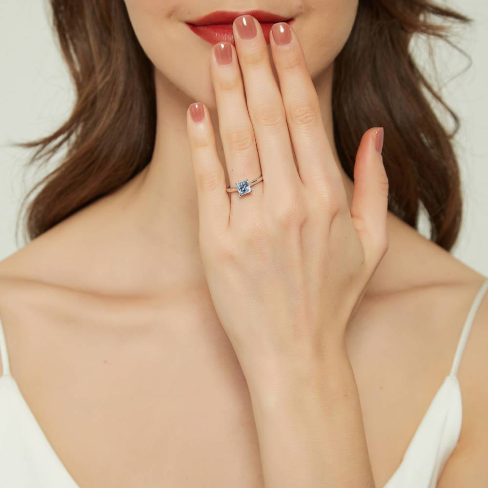 Model wearing Solitaire Greyish Blue Princess CZ Ring in Sterling Silver 1.2ct, 2 of 9