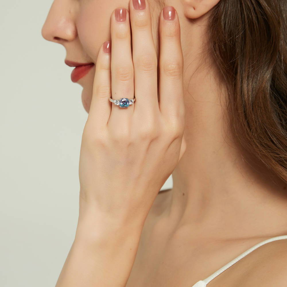 Model wearing 3-Stone Kaleidoscope Purple Aqua Cushion CZ Ring in Sterling Silver