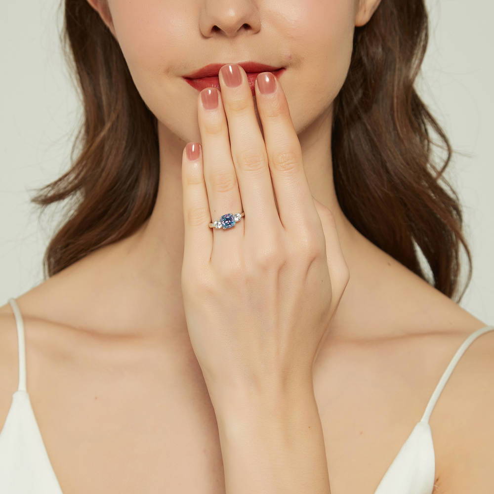 Model wearing 3-Stone Kaleidoscope Purple Aqua Cushion CZ Ring in Sterling Silver