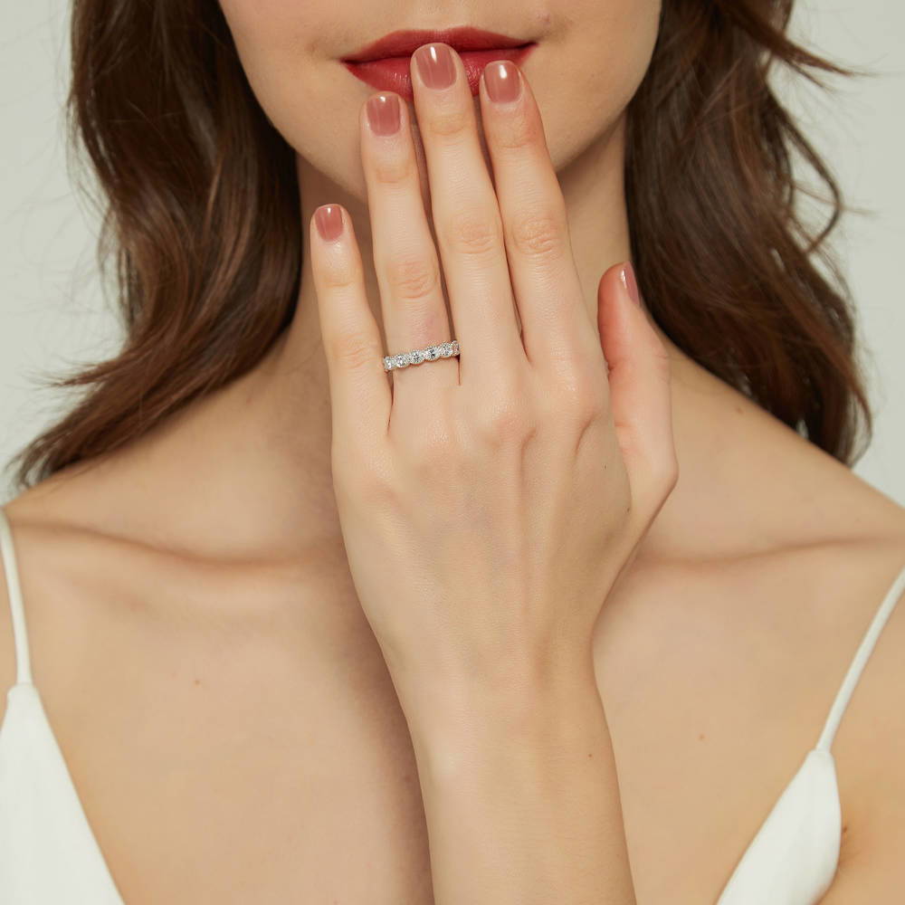 Model wearing East-West Milgrain Bezel Set Oval CZ Eternity Ring in Sterling Silver