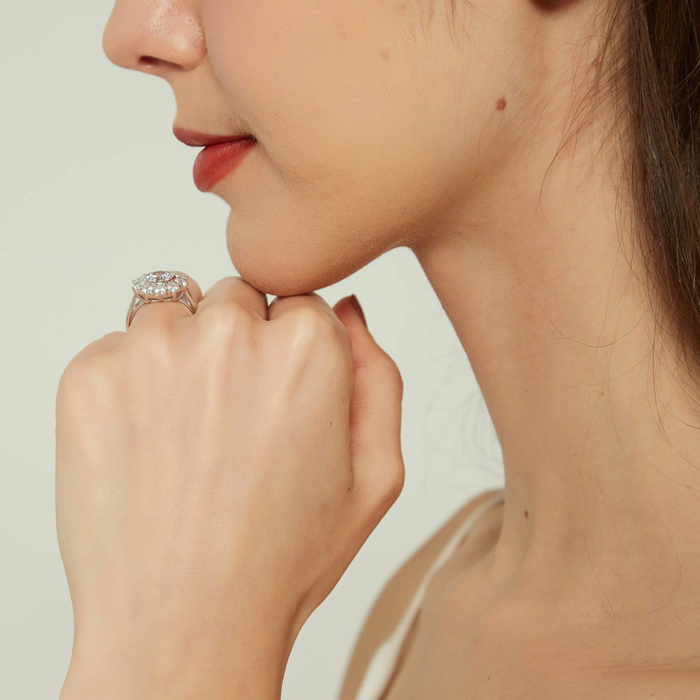 Model wearing Halo Flower Round CZ Ring in Sterling Silver, 9 of 10