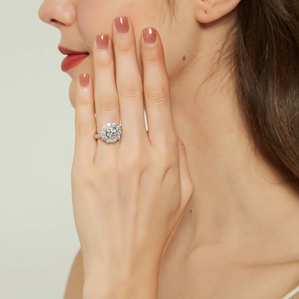 Model wearing Halo Flower Round CZ Ring in Sterling Silver