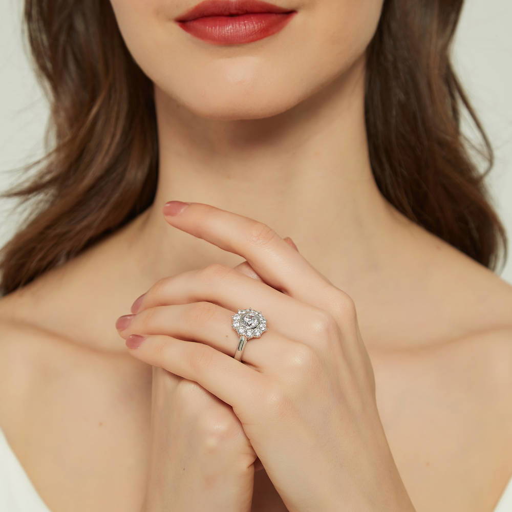Model wearing Halo Flower Round CZ Ring in Sterling Silver