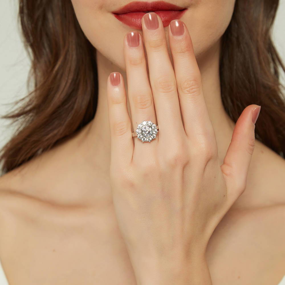 Model wearing Halo Flower Round CZ Ring in Sterling Silver