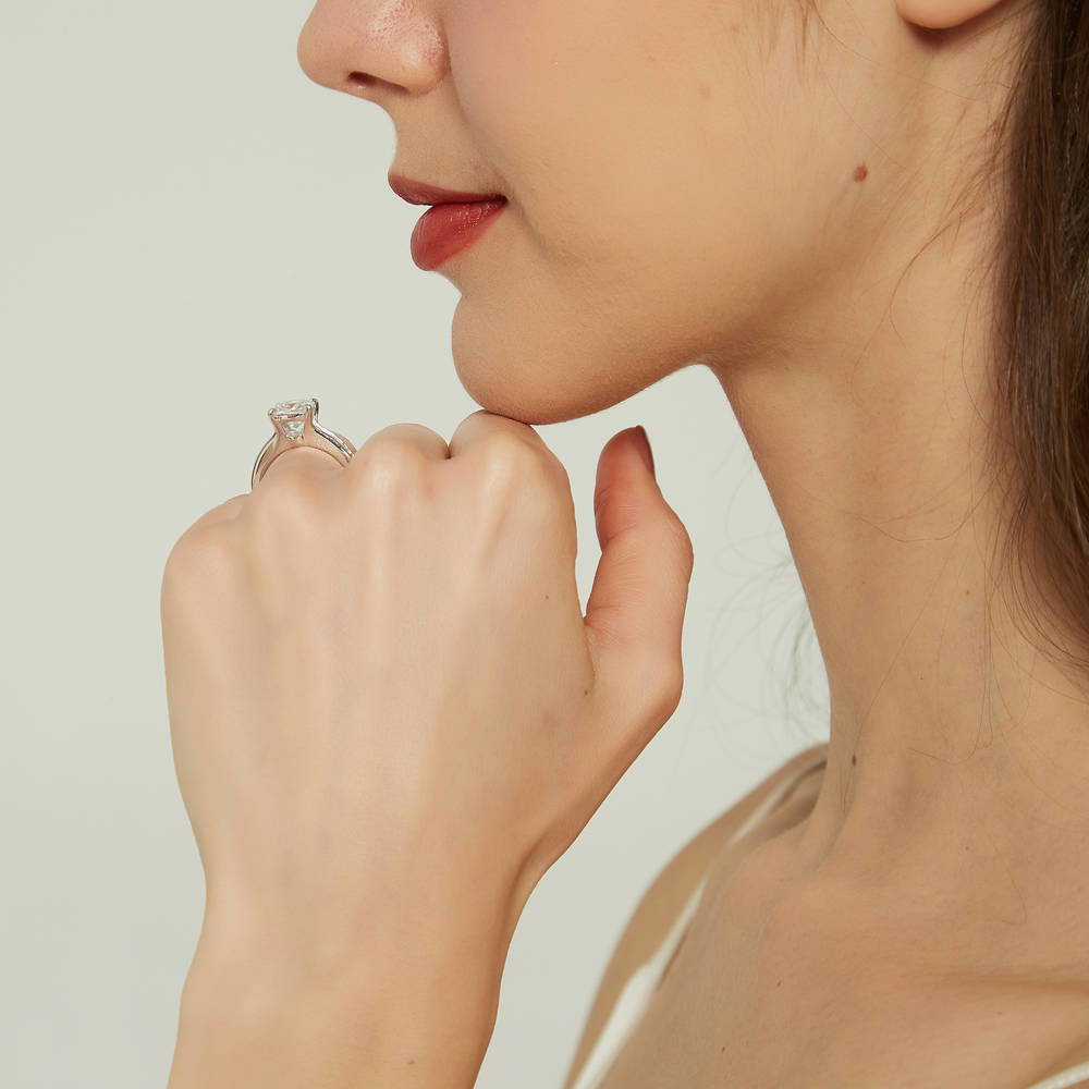 Model wearing Solitaire 3ct Cushion CZ Ring in Sterling Silver, 7 of 9