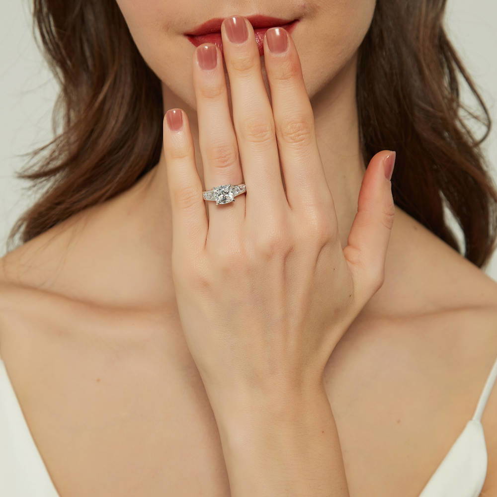 Model wearing Solitaire 3ct Cushion CZ Ring in Sterling Silver, 3 of 9